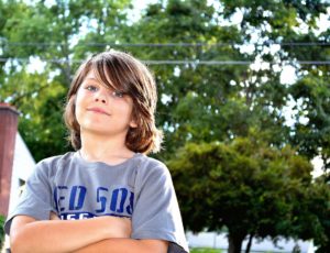 young boy in gray t-shirt 